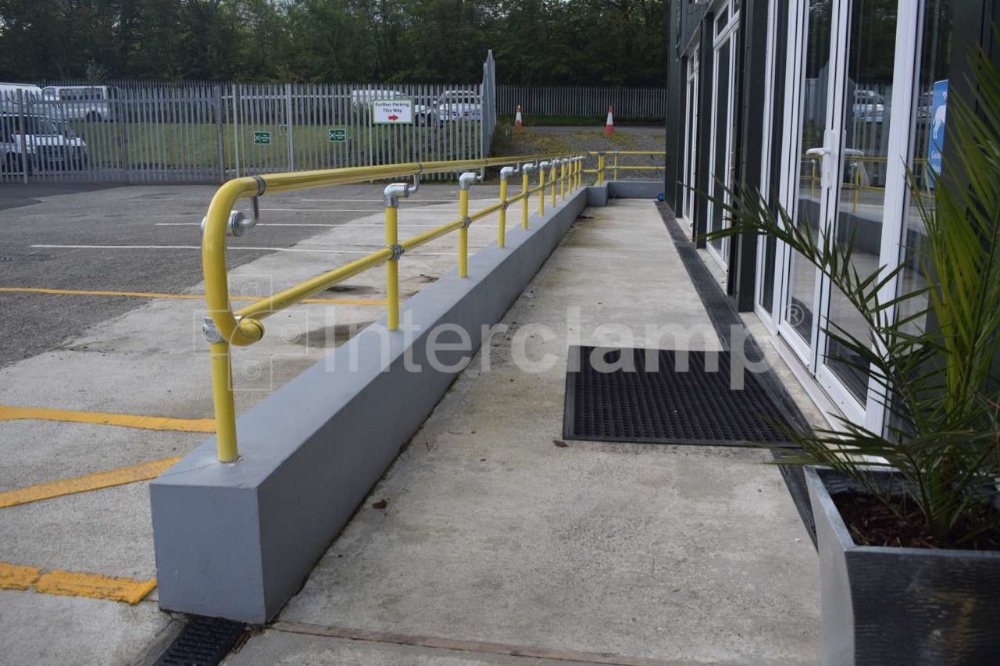 Yellow powder coated disabled handrailing contruced from Interclamp DDA Assist